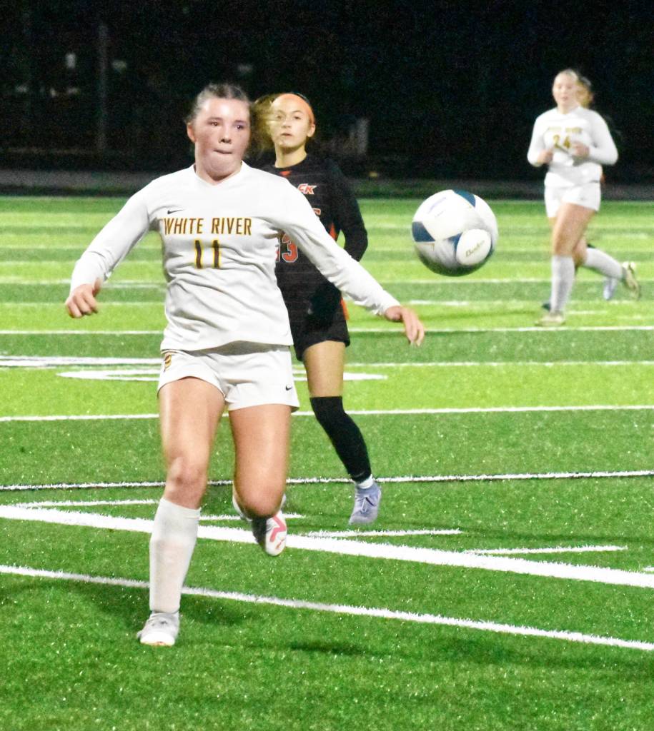 PHOTO BY KEVIN HANSON Belle Knauss, a senior defender for White River, looks to corral a loose ball during the Hornets Thursday night playoff game.