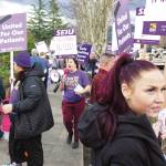 St. Elizabeth workers, friends, and family demonstrated in front of the local hospital last Thursday for higher wages, break nurses, and the financial ability to further their education or renew their licenses. Photo by Ray Miller-Still