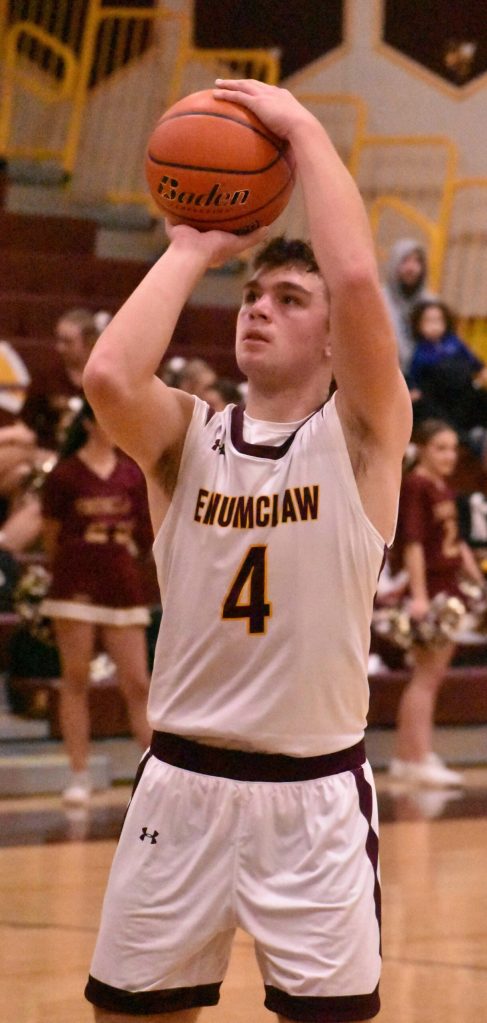 File photos by Kevin Hanson
Kannon Kuzaro (#4) returns as a key contributor to the Enumclaw High boys hoop program.