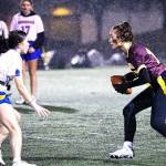 PHOTO COURTESY STEPHANIE FINDLEY 
Enumclaw High quarterback Madison Holden looks for an open receiver while avoiding a Tahoma defender during the Hornets first flag football game.