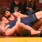 PHOTO BY KEVIN HANSON Enumclaw junior Romeo Gwerder, shown here on his way to a victory over a Todd Beamer opponent, was among the Hornets registering a fall during a December 3 home meet.