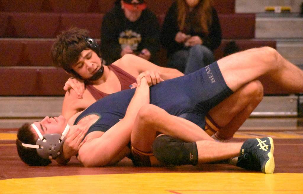 PHOTO BY KEVIN HANSON Enumclaw junior Romeo Gwerder, shown here on his way to a victory over a Todd Beamer opponent, was among the Hornets registering a fall during a December 3 home meet.