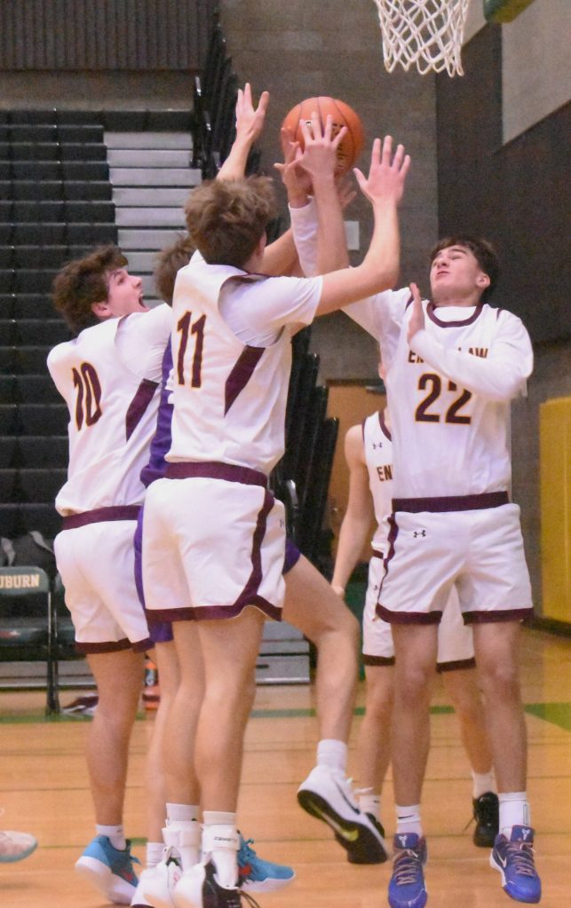 PHOTO BY KEVIN HANSON A trio of Hornets battle for a rebound during Saturday mornings game against Sumner. Pictured are Gavin Trachte (#10), Jason Feddema (#11) and Carson Tice (#22).