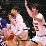PHOTO BY KEVIN HANSON EHS senior Gavin Trachte (#10) applies some second-half defensive pressure during the Hornets Saturday morning tourney victory.