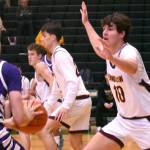 PHOTO BY KEVIN HANSON
EHS senior Gavin Trachte (#10) applies some second-half defensive pressure during the Hornets' Saturday morning tourney victory.