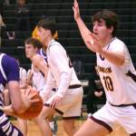 PHOTO BY KEVIN HANSON EHS senior Gavin Trachte (#10) applies some second-half defensive pressure during his teams December 13, nonleague victory over the Sumner Spartans.