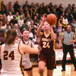 PHOTOs BY KEVIN HANSON
White Rivers Myia Olson puts up a shot during her teams Friday night victory in Enumclaw.