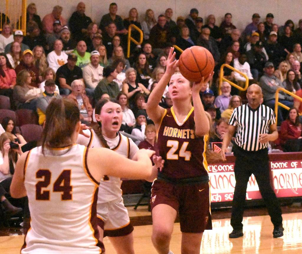 PHOTOs BY KEVIN HANSON
White Rivers Myia Olson puts up a shot during her teams Friday night victory in Enumclaw.