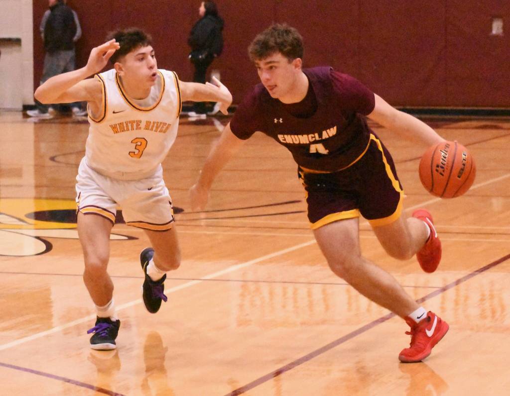 Applying some tough defense against Enumclaw are White Rivers Kolton Jensen (#4) and Ben Berg.