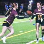 PHOTO BY KEVIN HANSON Brynn Findley takes a pitch from Madison Holden during a Hornet victory last week.