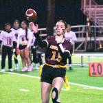 PHOTO BY KEVIN HANSON Hornet quarterback Madison Holden throws a pass during a Hornet victory at the Enumclaw Expo Center.