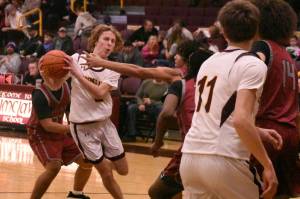 Hornet junior Jack Blair maneuvers through the lane during Enumclaws lopsided, Saturday night victory over Kentlake.