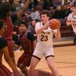 PHOTO BY KEVIN HANSON Landon Teeple (#23) works inside, facing a trio of Kentlake defenders, during Enumclaws NPSL 3A victory over the visiting Falcons.