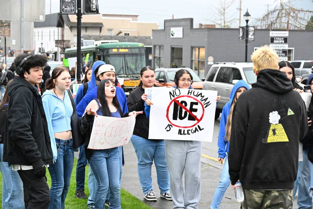 The man who was allegedly assaulted, pictured here on the right, was filming and interacting with students before the incident. Seconds before he was allegedly struck, he was surrounded by a group of yelling students; he began to blow an emergency whistle, but did not appear to attempt to leave the group. Photo by Ray Miller-Still