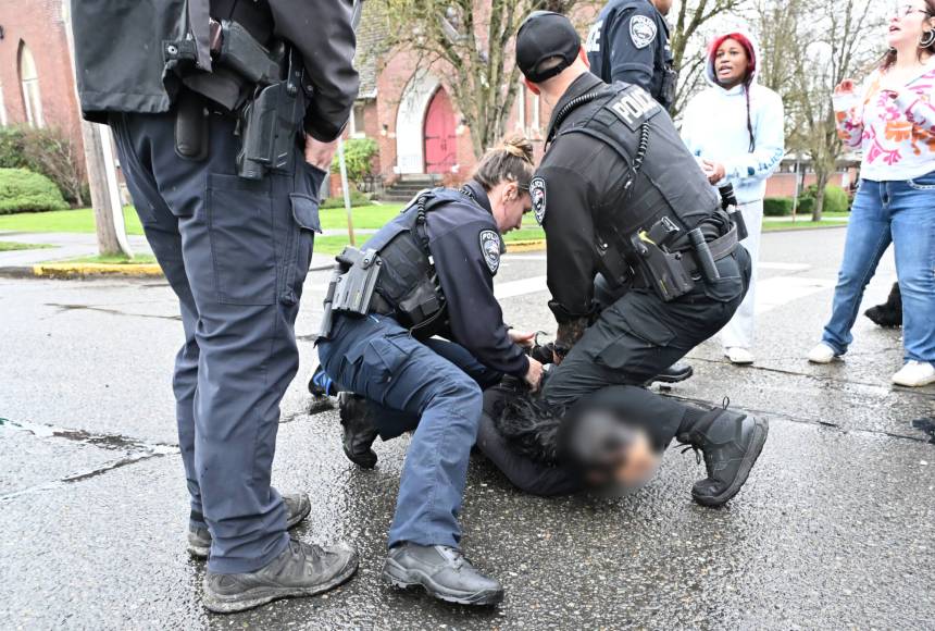 <p>The student who allegedly assaulted a man at the walkout was arrested by the Enumclaw Police Department on Porter Avenue. The Courier-Herald does not typically identify students accused of a crime, and the photo has been blurred. Photo by Ray Miller-Still</p>