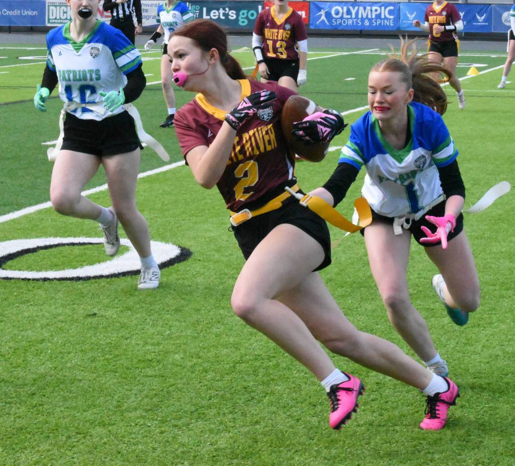 PHOTO BY KEVIN HANSON Jayna Vain (#2) turns the corner and picks up yardage during the early stages of White Rivers state tournament victory.