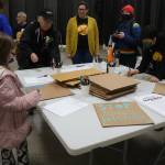 Participants make signs to bring to the Solidarity Day demonstration at the Northwest Detention Center in an event organized by Tsuru for Solidarity and La Resistencia. Photo by Bailey Jo Josie/Sound Publishing
