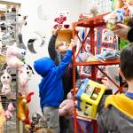 Marcellus Owen reaching for a toy for Killian Svenson in Plateau Outreach Ministrys childrens section. Photo by Ray Miller-Still