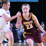 PHOTOs BY KEVIN HANSON
 Hornet scoring leader Maggee Schmitz (#22) drives to the hoop while on her way to a 28-point night against North Thurston