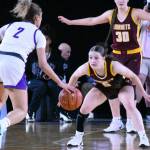 PHOTO BY KEVIN HANSON 
Hornet freshman Lilly Banks (#5) takes a defensive stance as North Thurstons Sierra Cordis looks for an opening; teammate Kaijah Young (#30) keeps watch under the basket.