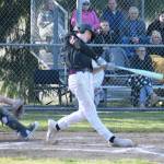 PHOTO BY KEVIN HANSON
Last weeks diamond duo of baseball games definitely went the way of the King County swarm of Hornets, as Enumclaw High swept White River in back-to-back NPSL 3A baseball games. In these photos, taken April 7 on White Rivers rural campus, Enumclaws Trey Kuzaro puts the ball into play during the early stages of what became a 14-3 EHS victory.