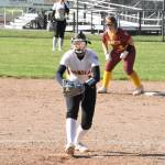 PHOTO BY KEVIN HANSON Plateau bragging rights were on the line Friday when Enumclaw High traveled to Buckley for a fastpitch softball showdown with White River. In This photo, EHS pitcher Adelyn Price prepares to deliver with a White River runner ready to take off from second base.