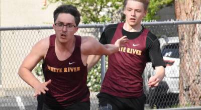 PHOTOs BY KEVIN HANSON 
Both the boys and girls track and field teams from White River were successful Thursday afternoon, defeating the visitors from Todd Beamer High. In this photo, Hunter Maris takes the baton from Aiden Roberts and runs the anchor leg in the 4x100 relay.