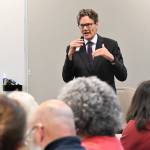 Dr. Mark Wenzel spoke at a public forum on May 14. Photo by Ray Miller-Still