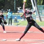 PHOTO BY KEVIN HANSON
Enumclaw High pitcher Adelyn Price is in full windup during her teams May 21 state playoff game against Shorewood. Holding down first base for the Hornets is Natalie Otero.