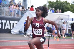 Jasmine Johnson runs for Kentlake. Ben Ray / Sound Publishing